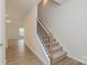 Bright stairway leads to the upper level, highlighting the home's layout at 1272 Langston Ln, Salisbury, NC 28144