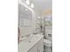 Bathroom with a large white sink, toilet, and large mirror at 1321 Arbor Dr, Salisbury, NC 28144