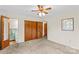 Bedroom with closet, ceiling fan and doorway to bathroom at 1321 Arbor Dr, Salisbury, NC 28144