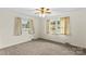 Bedroom with white walls, two windows and gray carpet at 1321 Arbor Dr, Salisbury, NC 28144
