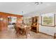 Spacious dining area showcasing wood paneling, a vintage hutch, and classic decor at 1321 Arbor Dr, Salisbury, NC 28144