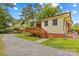 Charming home featuring a spacious back porch and well-maintained landscaping on a sunny day at 1321 Arbor Dr, Salisbury, NC 28144