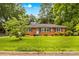 Attractive brick home featuring a well-kept lawn and classic design elements at 1321 Arbor Dr, Salisbury, NC 28144