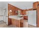 Kitchen with wood paneling, light countertops and white appliances at 1321 Arbor Dr, Salisbury, NC 28144