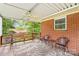 Relaxing outdoor patio with comfortable seating and an overhead fan at 1321 Arbor Dr, Salisbury, NC 28144