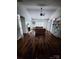 Bright living room boasting hardwood floors, a fireplace, and built-in bookshelves at 13409 Planters Row Dr, Charlotte, NC 28278