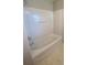 Clean and modern bathroom with a pristine bathtub and shower combination at 136 Mangum Cir, Mooresville, NC 28117
