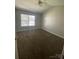 Spacious bedroom with neutral carpet, a ceiling fan, and natural light, perfect for relaxation at 136 Mangum Cir, Mooresville, NC 28117