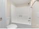 Clean bathroom featuring a white toilet and shower-tub combo at 140 Fairway Ln, Gastonia, NC 28216