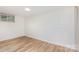 Bright bedroom features new flooring, a window and neutral paint at 140 Fairway Ln, Gastonia, NC 28216