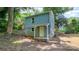 Exterior side-view of a house with blue siding and a yellow door at 140 Fairway Ln, Gastonia, NC 28216
