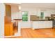 Bright kitchen with white cabinets, sleek countertops, hardwood floors, and modern fixtures at 140 Fairway Ln, Gastonia, NC 28216
