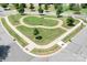 Aerial view displays a charming green common area, landscaped with trees and walkways, a place for community relaxation at 16324 Loch Raven Rd, Huntersville, NC 28078