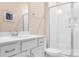 Bathroom featuring a shower with glass doors and a white vanity at 16324 Loch Raven Rd, Huntersville, NC 28078