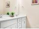 Bright bathroom with a double sink vanity, framed mirror, and clean aesthetic at 16324 Loch Raven Rd, Huntersville, NC 28078