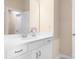 Cozy bathroom with a single sink vanity, framed mirror, and clean aesthetic at 16324 Loch Raven Rd, Huntersville, NC 28078