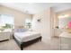 Comfortable bedroom with carpet flooring and a view of the backyard at 16324 Loch Raven Rd, Huntersville, NC 28078
