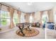 Bright game room featuring a foosball table, large windows, and cozy seating at 16324 Loch Raven Rd, Huntersville, NC 28078