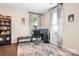 Bright home office with a desk, computer setup, and natural light from the window at 16324 Loch Raven Rd, Huntersville, NC 28078