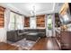 Comfortable living room with a large sectional sofa, hardwood floors, and natural light at 16324 Loch Raven Rd, Huntersville, NC 28078
