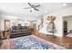 Open-concept living room with hardwood floors, modern decor, and a view of the kitchen at 16324 Loch Raven Rd, Huntersville, NC 28078