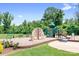 Community playground featuring slides, a climbing wall, and other recreational equipment on a beautiful, sunny day at 16324 Loch Raven Rd, Huntersville, NC 28078