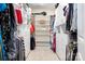 Spacious walk-in closet with custom shelves, ample storage, and carpeted floors at 16324 Loch Raven Rd, Huntersville, NC 28078