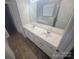 Bright bathroom featuring a double sink vanity with granite countertops and ample storage at 1715 Crabapple Tree Ln, Charlotte, NC 28214