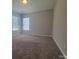Large bedroom with carpet floors and two windows for plenty of sunlight at 1715 Crabapple Tree Ln, Charlotte, NC 28214