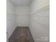 Walk-in closet with carpet floors and metal shelving at 1715 Crabapple Tree Ln, Charlotte, NC 28214