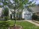 Charming two-story home featuring well-maintained landscaping, inviting curb appeal, and a convenient attached garage at 1715 Crabapple Tree Ln, Charlotte, NC 28214