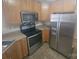 Well-equipped kitchen featuring stainless steel appliances, ample counter space, and tiled flooring at 1715 Crabapple Tree Ln, Charlotte, NC 28214