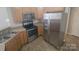 Well-equipped kitchen featuring stainless steel appliances, ample counter space, and tiled flooring at 1715 Crabapple Tree Ln, Charlotte, NC 28214