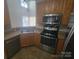 Well-equipped kitchen featuring stainless steel appliances, ample counter space, and tiled flooring at 1715 Crabapple Tree Ln, Charlotte, NC 28214
