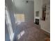 Bright open-concept living room with vaulted ceilings, fireplace, and large windows for ample sunlight at 1715 Crabapple Tree Ln, Charlotte, NC 28214