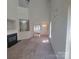 Bright open-concept living room with vaulted ceilings, fireplace, and view to entry and kitchen at 1715 Crabapple Tree Ln, Charlotte, NC 28214