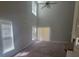 Bright open-concept living room with vaulted ceilings, fireplace, and large windows at 1715 Crabapple Tree Ln, Charlotte, NC 28214