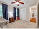 Another angle of the cozy bedroom, highlighting the closet and natural light at 1887 Steeplechase Dr, Rock Hill, SC 29732