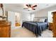 Cozy bedroom with ceiling fan and carpeted floor, featuring an iron-frame bed at 1887 Steeplechase Dr, Rock Hill, SC 29732