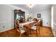 Cozy dining room with hardwood floors and a wooden table with seating for four at 1887 Steeplechase Dr, Rock Hill, SC 29732