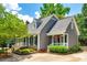 Charming two-story home with gray siding, a well-manicured lawn, and a beautifully landscaped yard at 1887 Steeplechase Dr, Rock Hill, SC 29732
