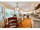 Charming kitchen with white cabinets, hardwood floors, and a breakfast nook with backyard views at 1887 Steeplechase Dr, Rock Hill, SC 29732