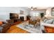 Comfortable living room featuring hardwood floors, a fireplace, and a TV at 1887 Steeplechase Dr, Rock Hill, SC 29732