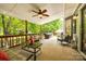 Spacious covered porch with seating, fan, and view of landscaped backyard at 1887 Steeplechase Dr, Rock Hill, SC 29732