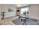 Home gym with exercise equipment, natural light and a durable floor mat for workouts at 2205 Gallberry Ln, Waxhaw, NC 28173