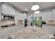 Gourmet kitchen featuring granite countertops, stainless steel appliances, an island and ample storage at 2205 Gallberry Ln, Waxhaw, NC 28173