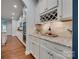 Modern kitchen with white cabinets, granite countertops, and a wine rack at 2205 Gallberry Ln, Waxhaw, NC 28173