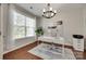 Bright office space with hardwood floors, a large window, and modern decor at 2205 Gallberry Ln, Waxhaw, NC 28173