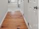 Hallway features beautiful hardwood floors, adding warmth and character to the home at 2308 Blair House Ct, Charlotte, NC 28270