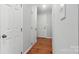 Hallway with hardwood floors with access to multiple rooms on a single Gathering home at 2308 Blair House Ct, Charlotte, NC 28270